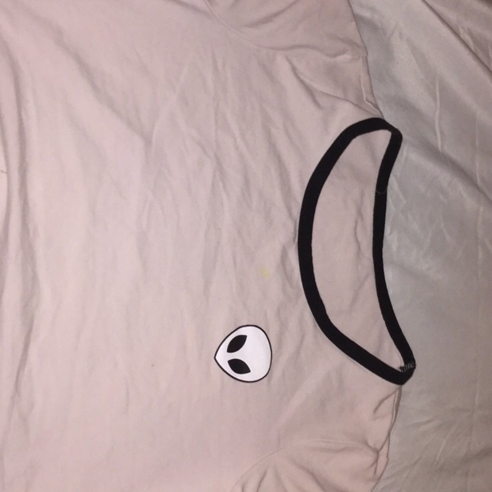 Light pink crop top with a zumiez logo